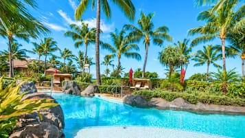 Outdoor pool, a waterfall pool, pool umbrellas, sun loungers