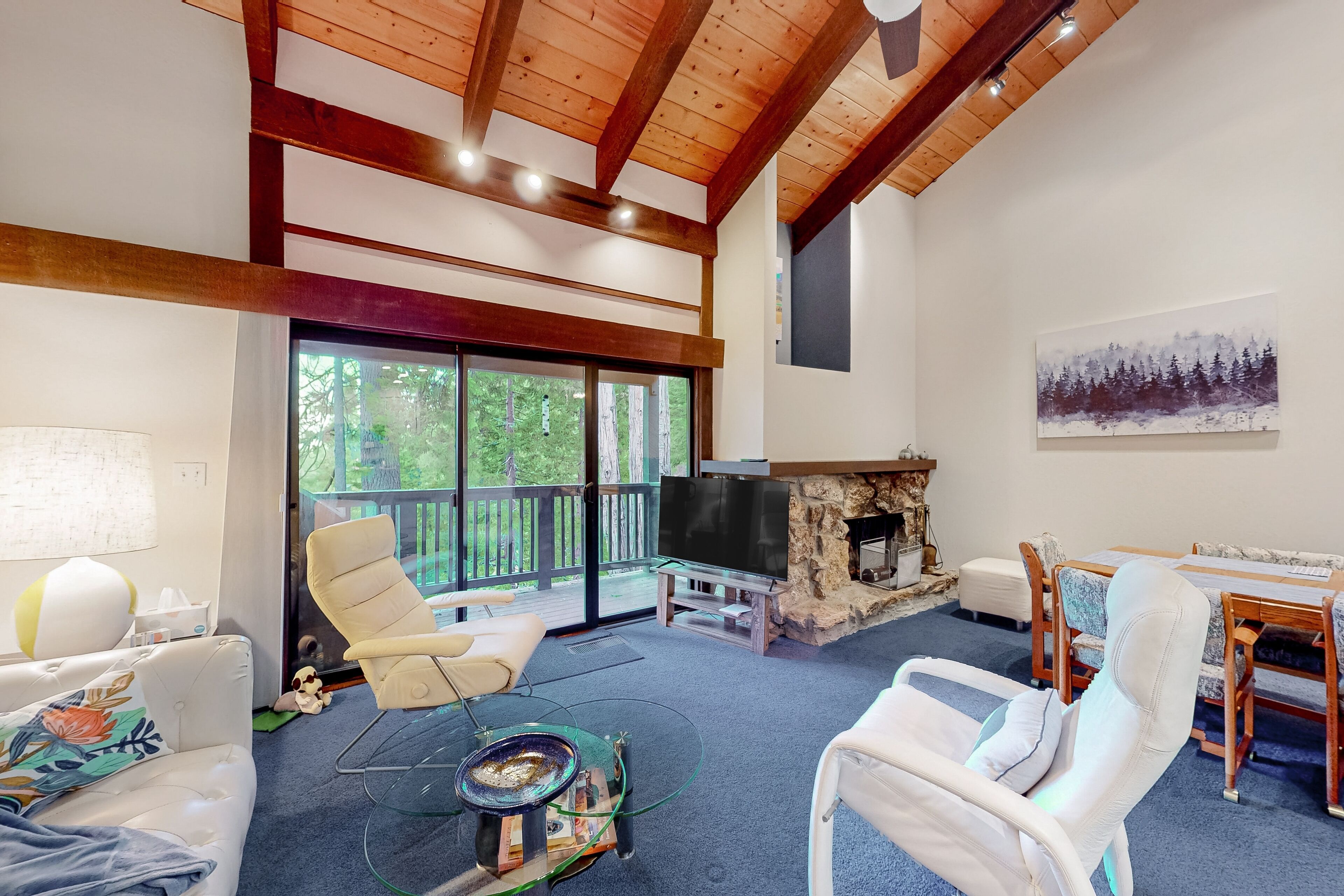 Welcoming condo with seasonal pool, tennis courts, fireplace, W/D & forest view
