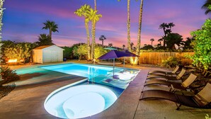 A swimming pool with lounge chairs and a small shed. - Upscale private paradise on large dog-friendly lot w/ free EV charger (Palm Springs)