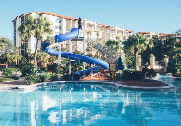 Relax by the pool surrounded by lush gardens and enjoy the resort's modern architecture.