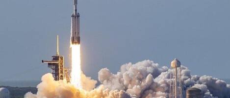 A rocket launch with smoke and flames.