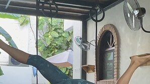 A person performing a handstand with one leg extended. - El Refugio de Sayulita - Solo Adultos (Sayulita)