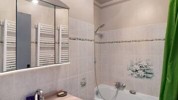 Bathtub, hair dryer, towels