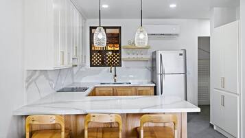 Coffee/tea maker, fridge, microwave, oven