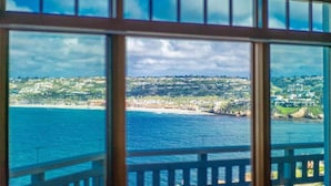 A coastal view through a window with a balcony railing. - East Cliff Beachfront Bliss at La Jolla Cove (La Jolla)