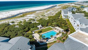 A resort with a swimming pool, beachfront views, and a beach area. - Gulf and Dune Views Steps from the Beach (Watersound)