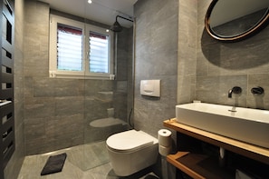 Shower, free toiletries, hair dryer, slippers