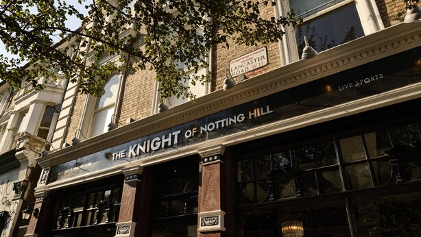 The exterior of The Knight of Notting Hill, a building with a classic architectural style, featuring large windows and a prominent sign above the entrance. - THE KNIGHT OF NOTTINGHILL (London)