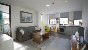 Standard Apartment, 1 Bedroom | Living area | 32-inch LED TV with digital channels