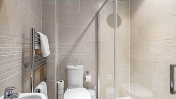 Bathtub, hair dryer, towels, soap