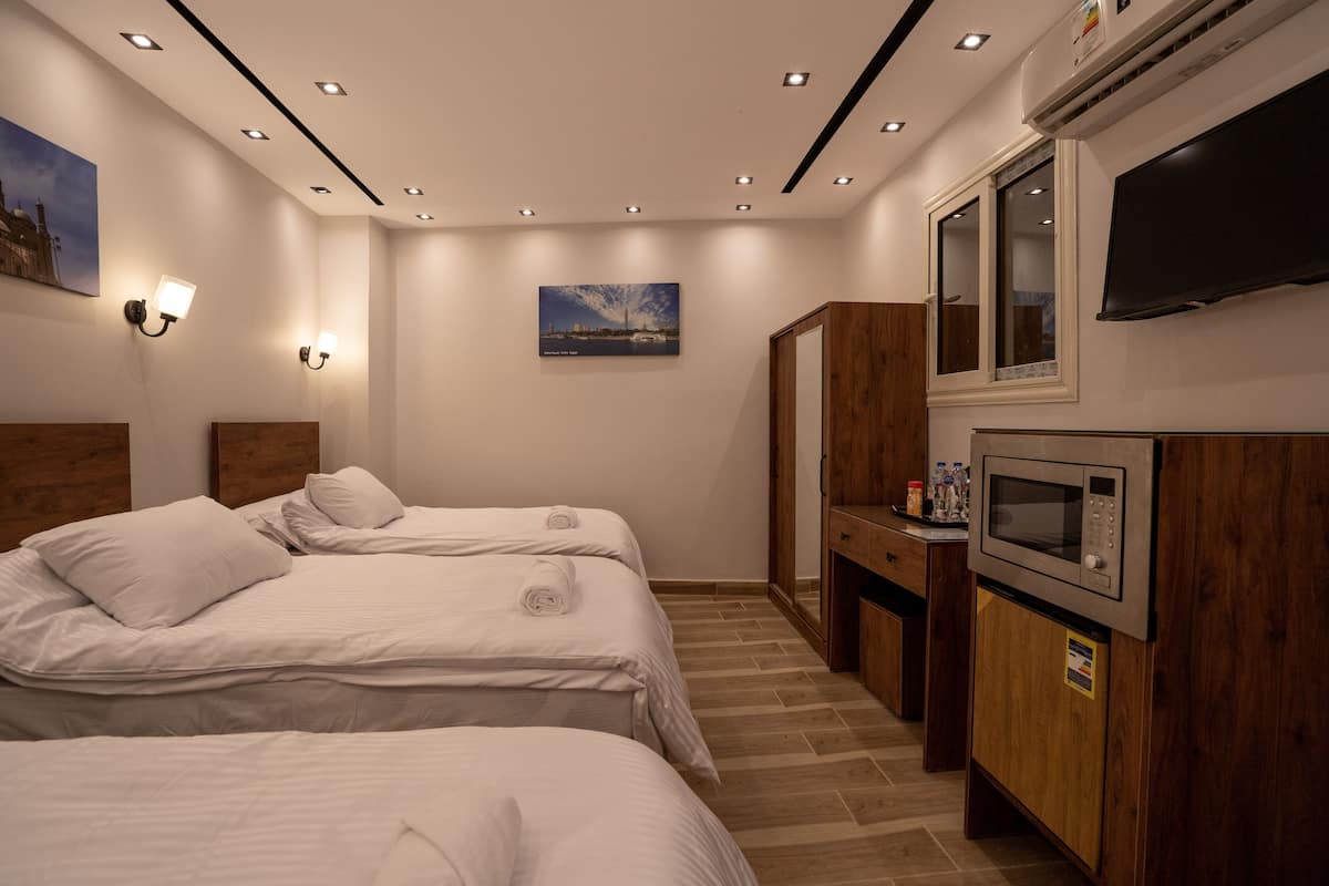 Deluxe Triple Room | Egyptian cotton sheets, premium bedding, memory foam beds, desk