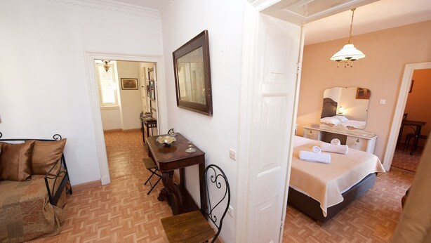 A hotel room with a bed, a desk, a chair, and a dining table. - Galiello & Bacco by CorfuEscapes (Corfu)