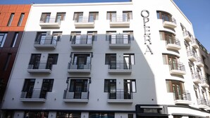 A multi-story building with balconies and a sign that reads "OPERA". - Opera Hotel  (Timisoara)