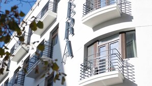 A white building with multiple balconies and windows. - Opera Hotel  (Timisoara)