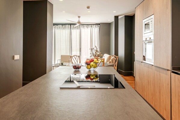 Enjoy cooking and dining in this well-equipped kitchen with a central island and induction cooktop.