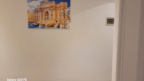 A painting of a grand building with classical architecture, a fountain, and a clear sky. - 5 minutes walk from saint peter vatican museums castel sant angelo. At 50m meter (Roma)