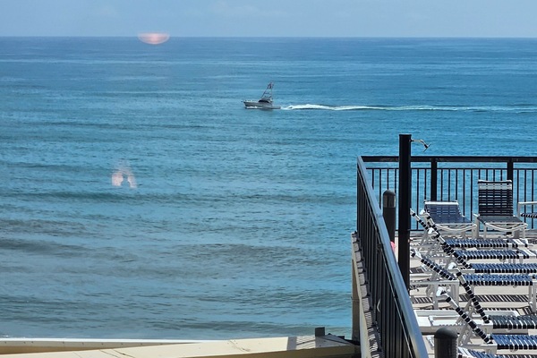 New Smyrna looking for dolphins from balcony.