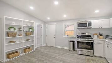 Coffee/tea maker, fridge, microwave, oven