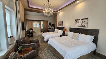 Premium bedding, laptop workspace, iron/ironing board