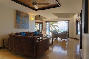 Luxury Villa, Private Pool, Beachfront | Living area | 50-inch flat-screen TV with cable channels