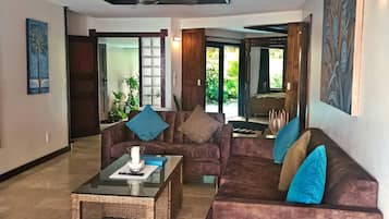Luxury Villa, Private Pool, Beachfront | Living area | 50-inch flat-screen TV with cable channels