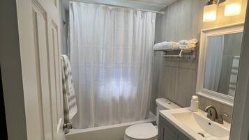 Shower, hair dryer, towels, soap