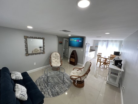 Living area. Lovely comfy clean apartment. Close to State parks/ beaches/ restaurants.