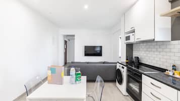 Apartamento | Área de estar | TV