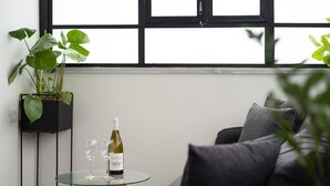 Apartment, 1 Bedroom | Living area | Netflix, streaming services - The Square - By Beach Apartments TLV (Tel Aviv)