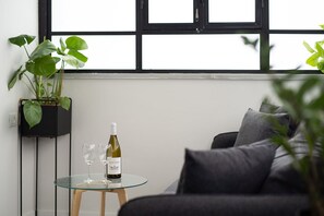 Apartment, 1 Bedroom | Living area | Netflix, streaming services - The Square - By Beach Apartments TLV (Tel Aviv)