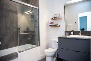 Bathtub, hair dryer, towels