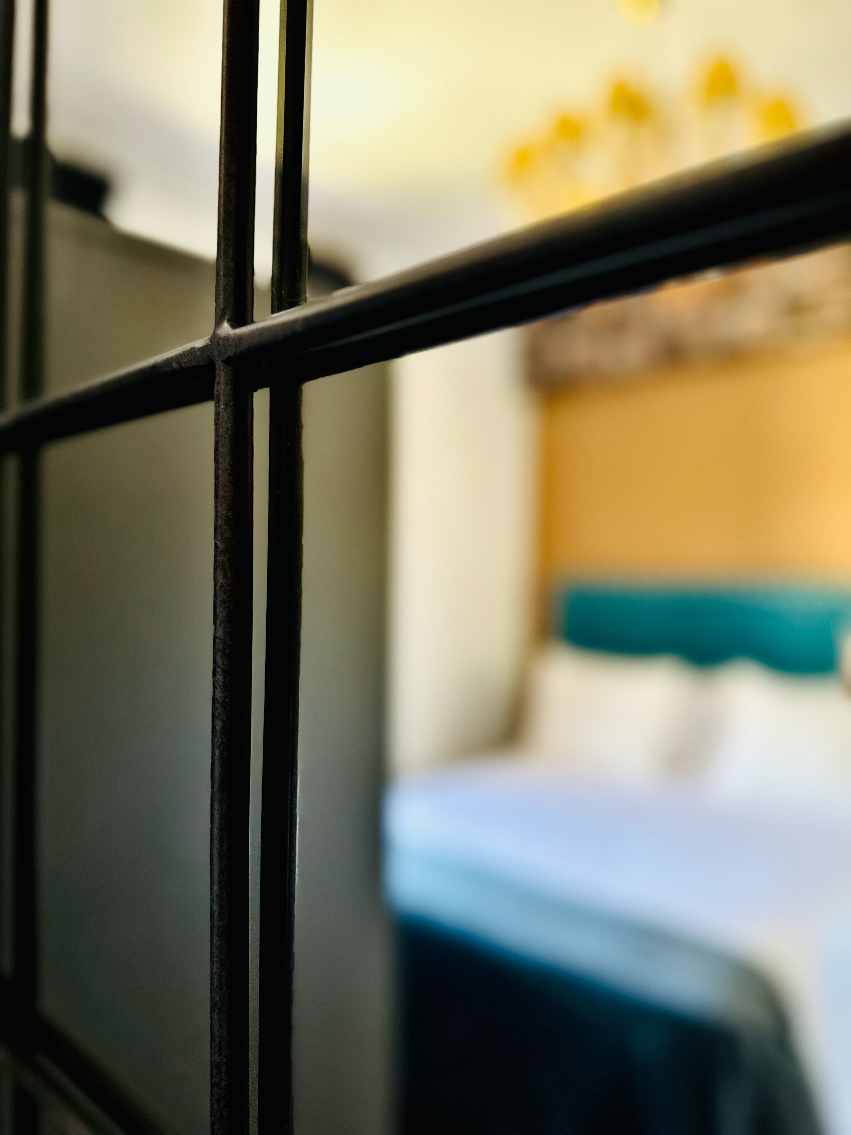 A close-up of a metal railing, likely part of a room's interior structure.