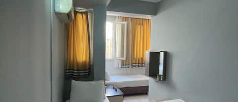 City Triple Room | 1 bedroom, premium bedding, iron/ironing board, free WiFi