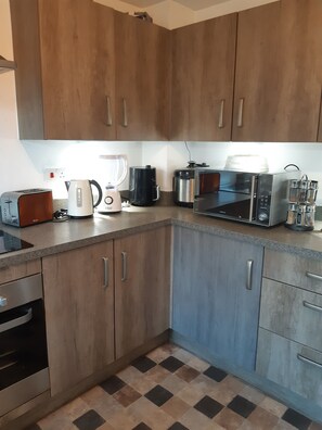 Casa | Cucina privata | Frigorifero, microonde, forno, piano cottura