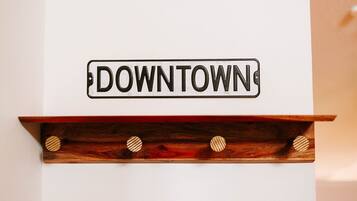 A sign with the word 'DOWNTOWN' on a white background.