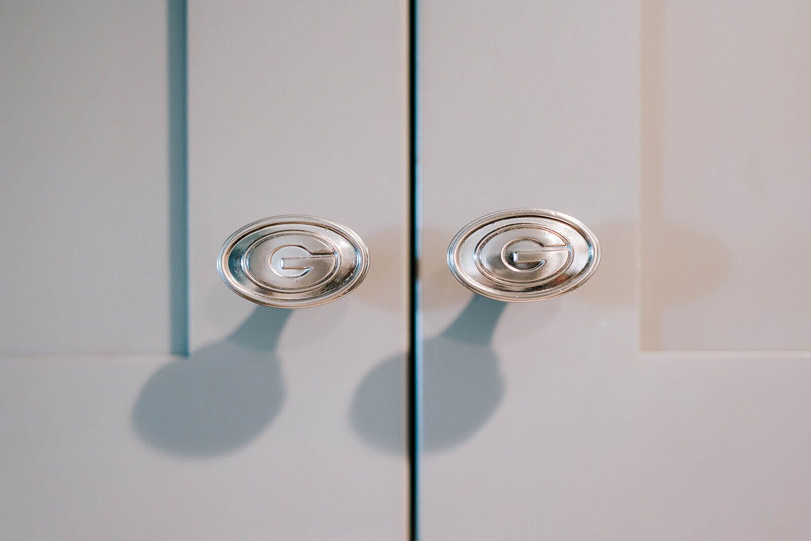 A door with two metallic handles.