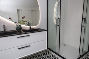 Shower, hair dryer, towels, soap