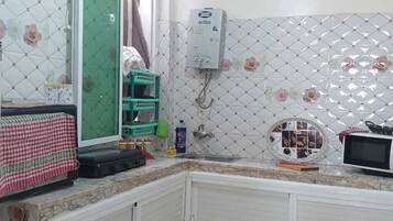 Basic Apartment, 2 Bedrooms | Private kitchen | Fridge, microwave, cookware/dishes/utensils