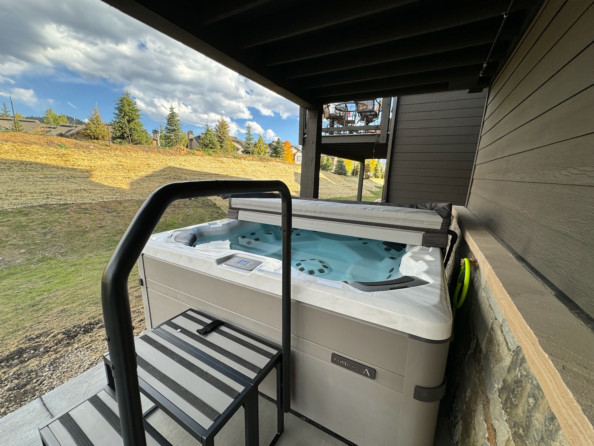 Private covered hot tub with peaceful yard views year-round