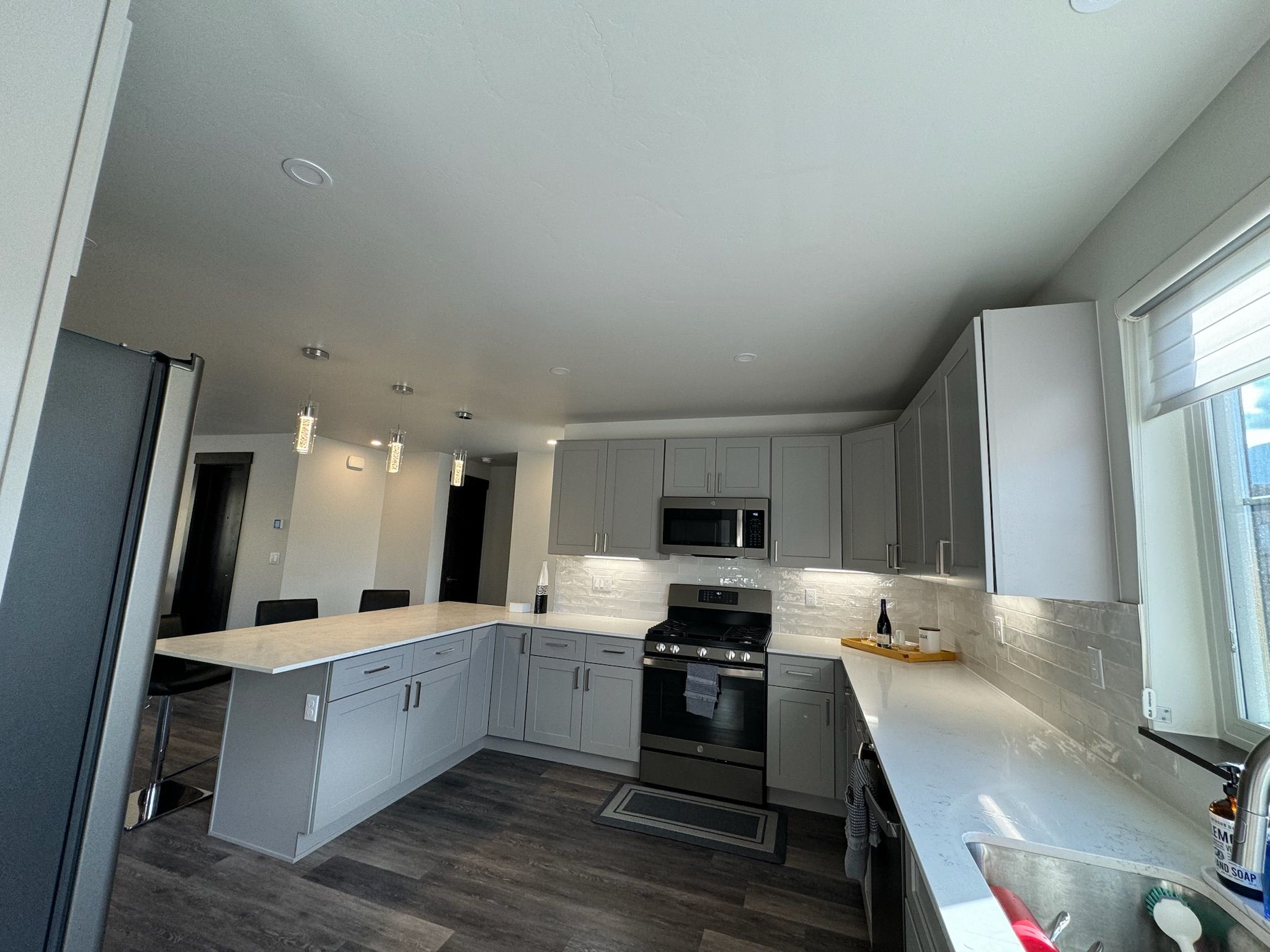 Bright modern kitchen with bar seating and stylish finishes