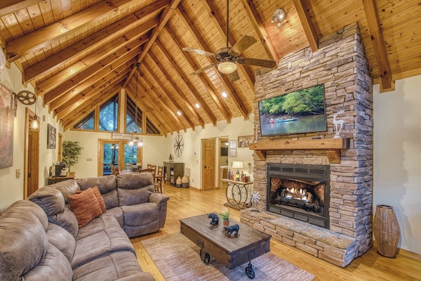 Sink into the cozy sectional couch by the gas fireplace and smart TV.