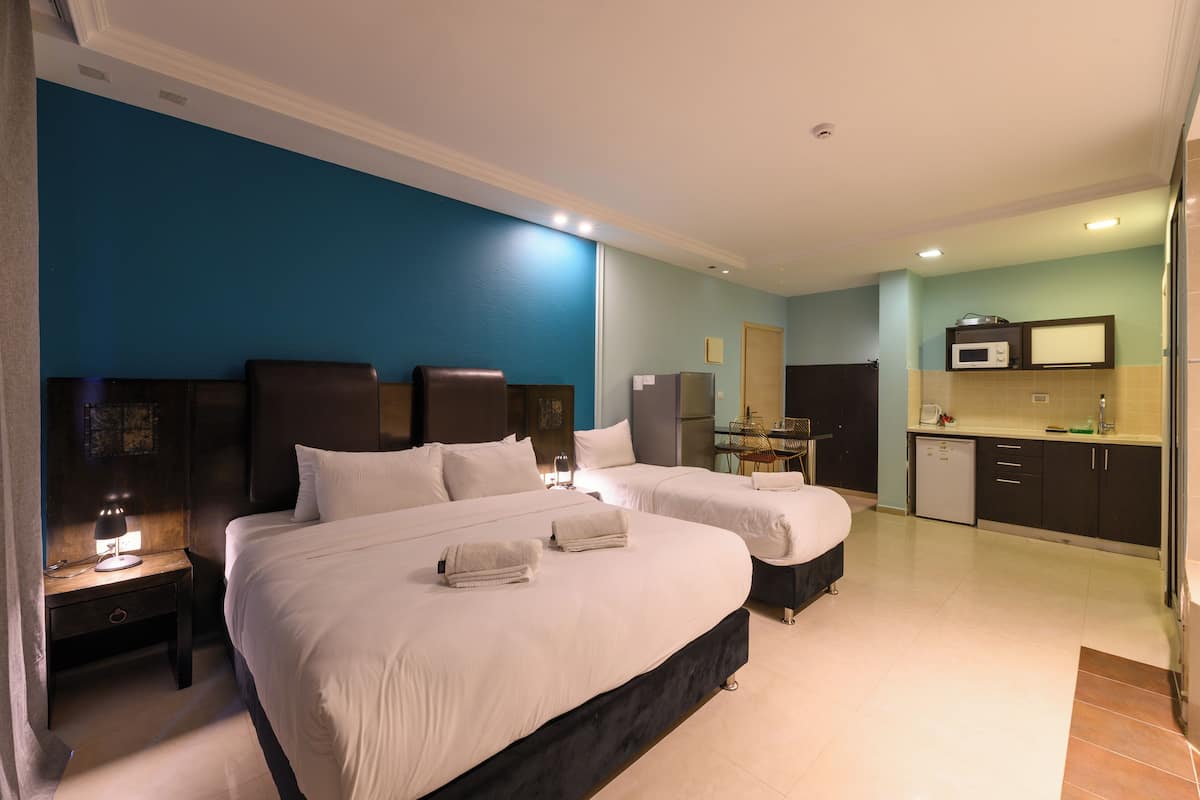 Deluxe Quadruple Room, Sea View | In-room safe, desk, laptop workspace, soundproofing
