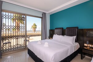 Deluxe Quadruple Room, Sea View | In-room safe, desk, laptop workspace, soundproofing
