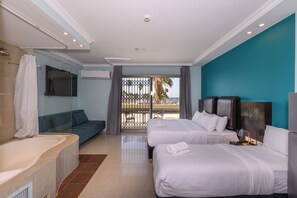 Deluxe Quadruple Room, Sea View | In-room safe, desk, laptop workspace, soundproofing - Marina Beach Hotel (Tel Aviv)