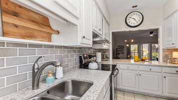 Coffee/tea maker, fridge, microwave, oven