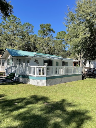 Super roomy Park Model in premier resort with lake, pools, dock and boat launch.