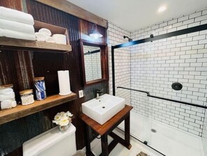 Shower, hair dryer, towels, soap