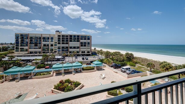 A hotel with a beach view, multiple floors, and outdoor seating areas. - BEACH VACATION ON BEAUTIFUL SAND KEY CLEARWATER 3BR w/ Private Beach Access
(Clearwater)