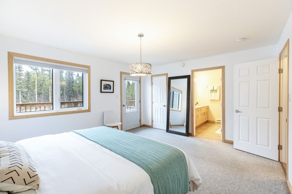 Primary bedroom- King bed, ensuite bath, walkin closet and access to upper deck