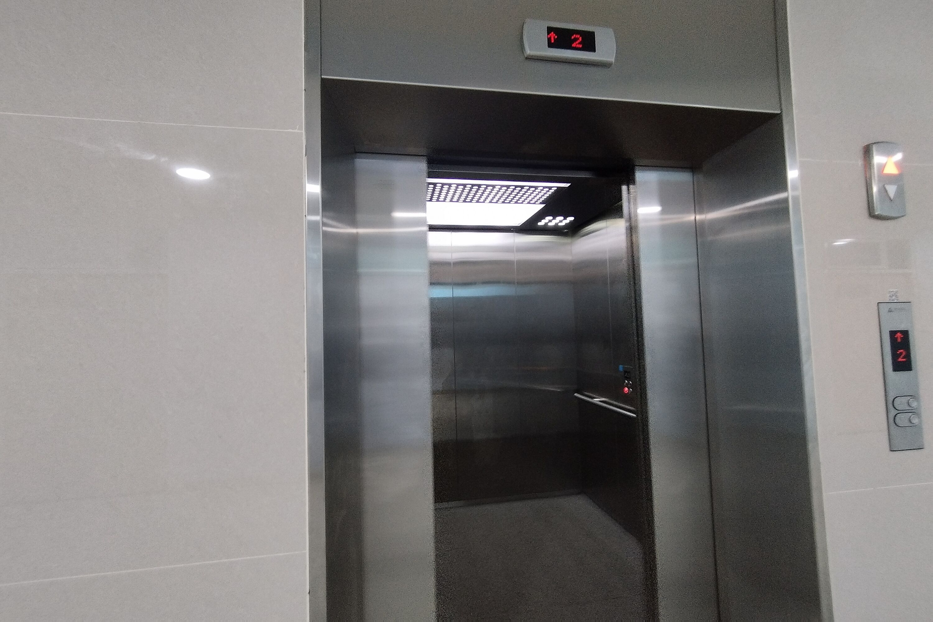 An elevator with a digital display indicating the floor number.